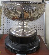 A circular silver pedestal bowl, with embossed decoration, weight 14oz