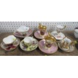 Seven decorative cabinet cups and saucers