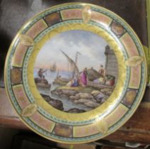 A Meissen cabinet shallow dish, decorated with figures in a harbor, diameter 11.5ins