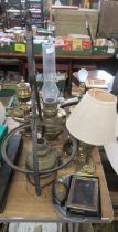 Two silver frames and various oil lamps