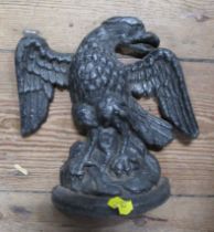 A wrought iron door stop, modelled as an eagle, height 8ins