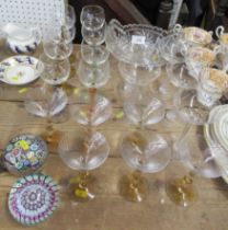 A collection of drinking glasses, a bowl and two paperweights