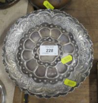 A circular silver shallow dish, with embossed decoration, weight 4oz