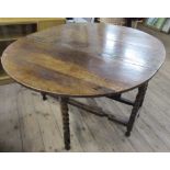 An Antique oak gateleg table, on bobbin turned legs, 47.5ins x 58.5ins, height 29ins