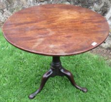 A 19th century mahogany circular tripod table, with bird cage action, diameter 34ins