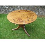 An oak tripod table diameter 35ins height 28ins