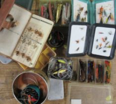 A collection of fishing flies, gaffes and other fishing items