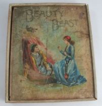 A Victorian Beauty and the Beast boxed wooden puzzle set, by Loughlin Bros. New York, with booklet