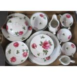 A porcelain tea set, decorated with roses, together with another tea set and other items