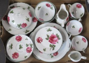 A porcelain tea set, decorated with roses, together with another tea set and other items