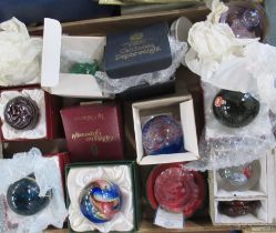 A collection of boxed glass paperweights