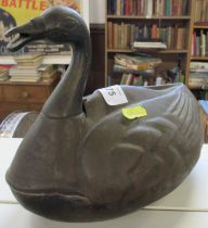 An Eastern metal desk inkwell, formed as a duck, with hinged section to its back