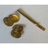 A pair of yellow metal oval cufflinks, with motto Honi Soit Qui Maly Pense, weight 14.5g, together