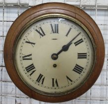A small oak cased wall clock, overall diameter 10.5ins