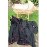 A wicker cot/Moses basket, on stand, together with a hooded cape, a university black gown and a coal
