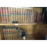 Two shelves of leather bound book