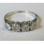 A four stone diamond ring, set in white metal, total diamond weight approx. 0.45ct