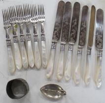 A silver leaf caddy spoon, together with a set of six mother of pearl handled fruit knives and forks