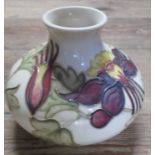 A Moorcroft Pottery vase, decorated in the Columbine pattern, height 5ins