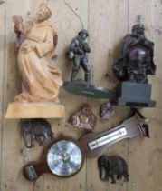 A carved wooden model, of a monk, together with a bronzed fisherman and other models, records and