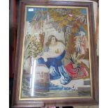 A framed tapestry picture