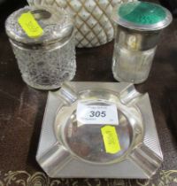 A hallmarked silver ash tray together with two silver mounted dressing table items