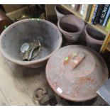 A collection of garden pots, weights etc