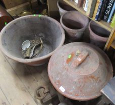 A collection of garden pots, weights etc