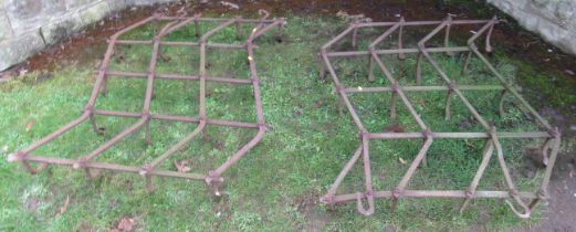 A pair of wrought iron harrows, each 52ins x 36ins