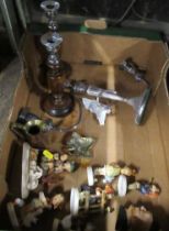 A collection of Hummell figures, a character jug, candlesticks etc