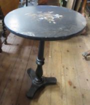 A 19th century papier mache table, with mother of pearl and painted flower decoration, diameter