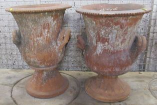 A pair of terracotta campagna shaped garden urns, af, height 21.5ins