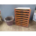 A fruit rack, fitted eight drawers, width 28ins, height 35ins, depth 19ins, together with a basket