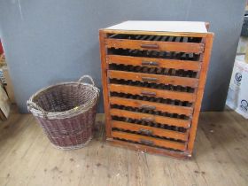 A fruit rack, fitted eight drawers, width 28ins, height 35ins, depth 19ins, together with a basket