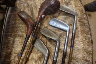 A set of vintage golf clubs and bag