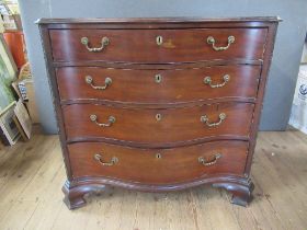 A Georgian mahogany serpentine front chest of drawers, fitted four graduated  drawers , raised on