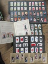 Six cigarette card albums and cards