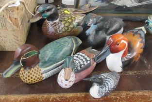 12 carved wooden ducks, with painted decoration