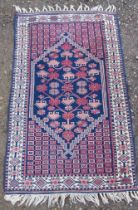 An Eastern design rug, 55ins x 33ins