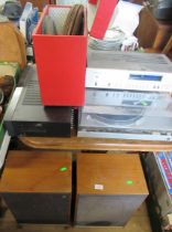 A collection of record players, speakers, polyphon discs etc