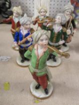 A Sitzendorf porcelain six piece band, with figures plating musical instruments, height 6ins