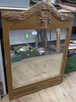 A gilt framed wall mirror