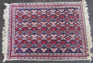 Three Eastern design rugs. 85ins x 56ins, 44ins x 32ins and 62ins x 49ins