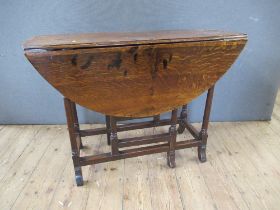 An Antique oak gate leg table, width 38ins, height 28ins