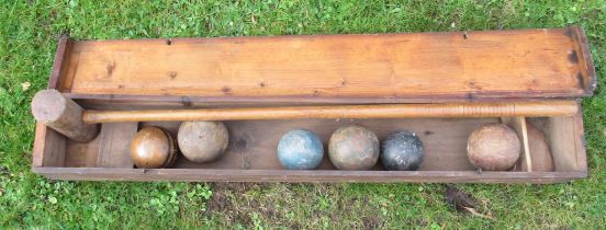 A Jaques & Son London wooden box, containing a wooden croquet mallet and 6 balls