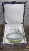 A boxed Oriental egg shell tea bowl, with shaped edge, diameter 3.5ins