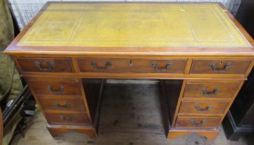 A reproduction mahogany pedestal desk, with yew drawer fronts, width 48ins, depth 24ins, height