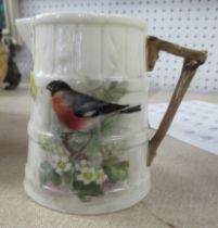 A Royal Worcester barrel moulded jug, decorated with a Chaffinch by Powell, height 3.75ins, together