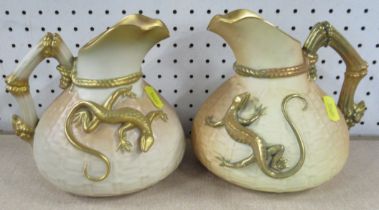 Two Royal Worcester blush ivory jugs, with basket weave body and applied with a gilt lizard, shape
