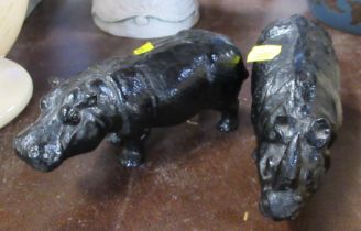 Two papier mache models, a rhino and a hippo